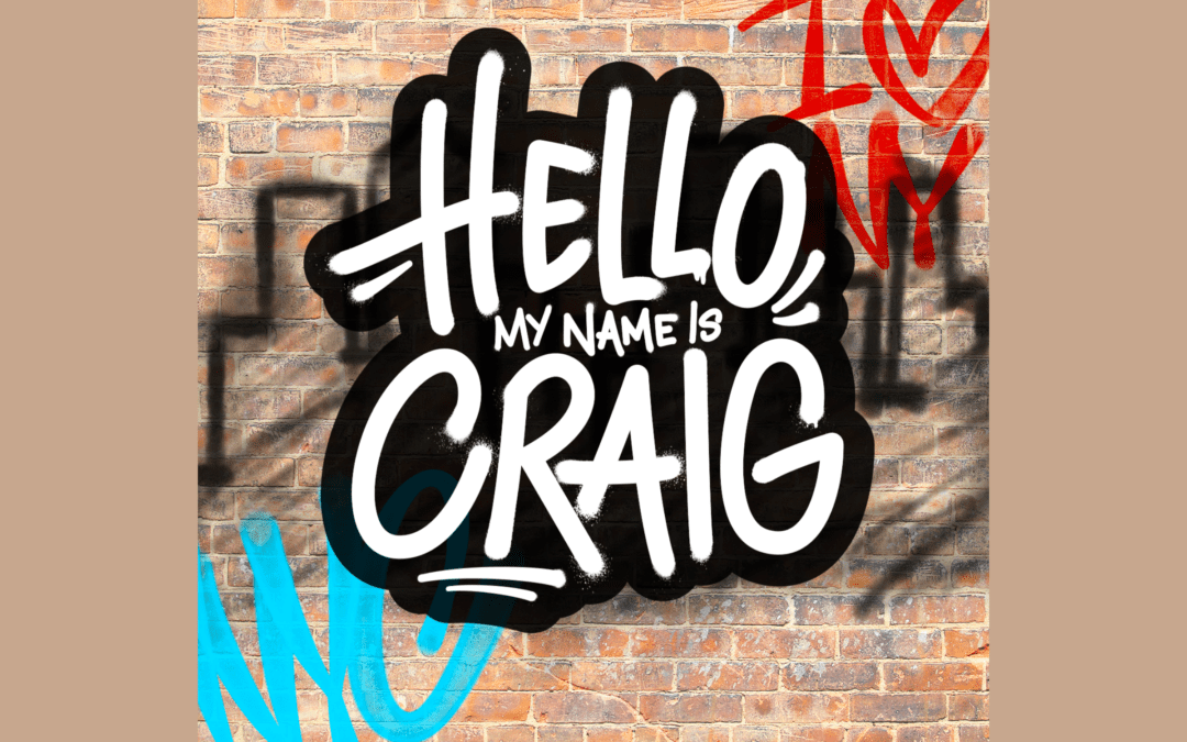 hello, my name is craig logo in front of a brick wall with graffiti