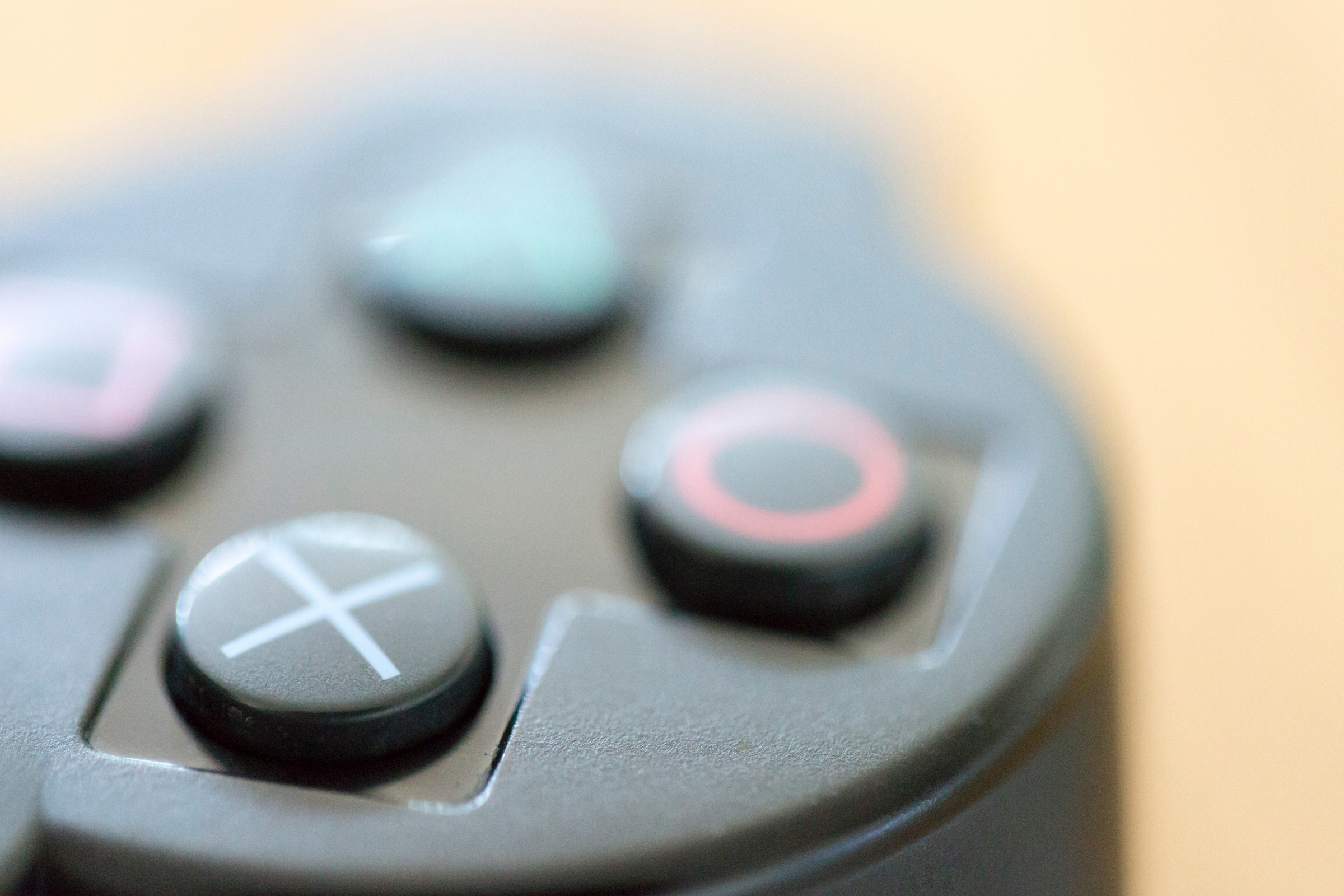 a close up view of the four main buttons on a video game controller